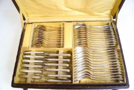 A French silver plated canteen of fiddle thread and shell cutlery, twelve place setting,