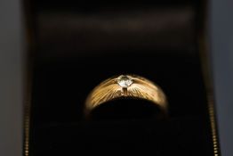 A diamond single stone ring, the star set brilliant cut of approximately 0.