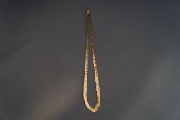 A 9 carat three colour gold necklace, of plaited flat links,