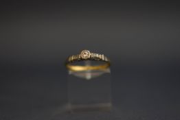 A single stone diamond ring, stamped '18ctPlat', the Swiss cut stone illusion set, finger size N, 2.