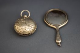A silver vanity purse mirror, by Crissford & Norris; and a silver Sovereign case,