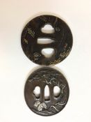 A 20th century Japanese bronze tsuba with wave and fan decoration, signed, 8cm diameter,