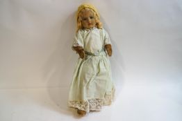 A 1940s/50s Chad Valley & Co fabric girl doll with painted facial features,