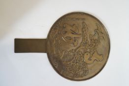 A Japanese bronze hand mirror with moulded cranes in flight and inscription,