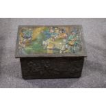 An embossed brass coal box, the top decorated and painted with figures drinking in a tavern,