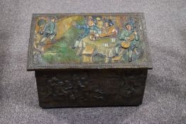An embossed brass coal box, the top decorated and painted with figures drinking in a tavern,