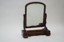 A Victorian mahogany swing frame dressing table mirror, with central lidded box,