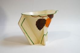 A Clarice Cliff prototype cream jug of conical form, painted with Autumnal leaves,