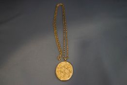 A large 9 carat gold oval locket, 4.