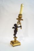 A 19th century bronze and ormolu candlestick, converted to a lamp,