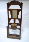 A late Victorian oak hallstand with carved detail including a Green Man,