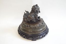 A 19th century Chinese bronze censor cover, cast as a Dog of Fo, 20.
