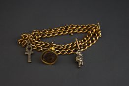 A bracelet of two rows of solid curb links, stamped '15', with a seal, a Lincoln Imp charm,