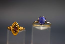 A single stone sapphire ring, indistinctly marked,