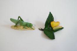A Herend porcelain model of a cricket, and one of a butterfly, factory marks to underside,