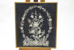 A lacework picture of flowers within a garland, by Joan Payne, cased,