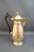 A silver hot water jug, Birmingham 1914, 24 cm high, 532 g (17.