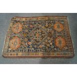 A small Middle Eastern rug with central diamond,