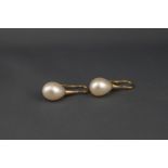 A pair of cultured pearl drop earrings with yellow shepherd's crook fittings, stamped '18k', approx.