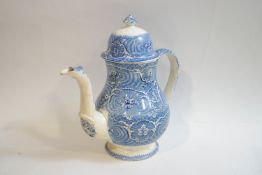 A Victorian earthenware coffee pot and cover with blue transfer printed flower decoration,