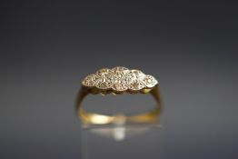 An early 20th century gold and diamond eight stone ring,