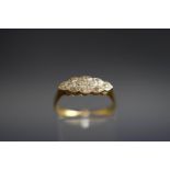 An early 20th century gold and diamond eight stone ring,