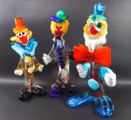 Three Venetian glass clowns, one with paper label, smallest 25cm,