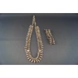 An Indian silver fringe necklace and matching bracelet, each with rows of curb links,