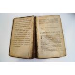 An 18th century copy of The Life and Adventures of Robinson Crusoe, with half calf binding,