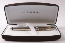 A Cross silver cased fountain pen, the nib marked 18K, 750,