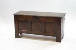 A 17th century and later oak coffer, with triple panelled front,