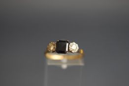 An 18ct gold, blue paste and diamond three stone ring,