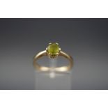 A Gems TV 9ct gold and round mixed-cut peridot-coloured single stone ring, Birmingham 2005, size N,