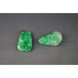 Two green jade pendants, each carved in high relief with fruit and leaves, approx. 3cm high & 2.