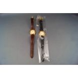 Renato, two lady's gold-plated and coloured gem set round quartz wrist watches, on leather straps,
