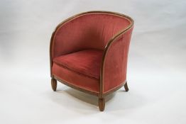 A 1930s mahogany tub shaped chair on turned octagonal front legs,
