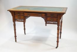 A Victorian mahogany writing table by Edwards and Roberts,