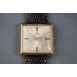 Cornavin, Geneve, a vintage gold-plated and stainless square wrist watch,