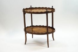 An Edwardian mahogany two tier marquetry table,
