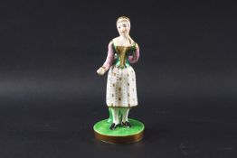 An early 19th century Chamberlains porcelain figure of the Broom Girl, modelled as Madame Vestris,
