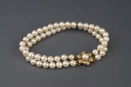A cultured pearl two row bracelet, the uniform beads approx. 5.75mm - 6.