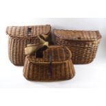 Three wicker fishing creels of varying size