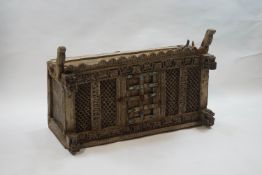 An Indian carved wooden cupboard,