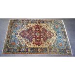 A Persian rug with central lobed medallion and stylised floral pattern to the field,