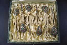 A set of six early 20th century Russian silver and cloisonne enamelled coffee spoons,