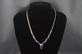 A lapis lazuli mounted necklace,