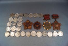 Four 1947 Chinese Communist medals and a collection of mostly Chinese silver-coloured coins