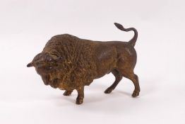A gilded brass model of a bull,