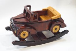 A wooden rocking car,