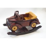 A wooden rocking car,